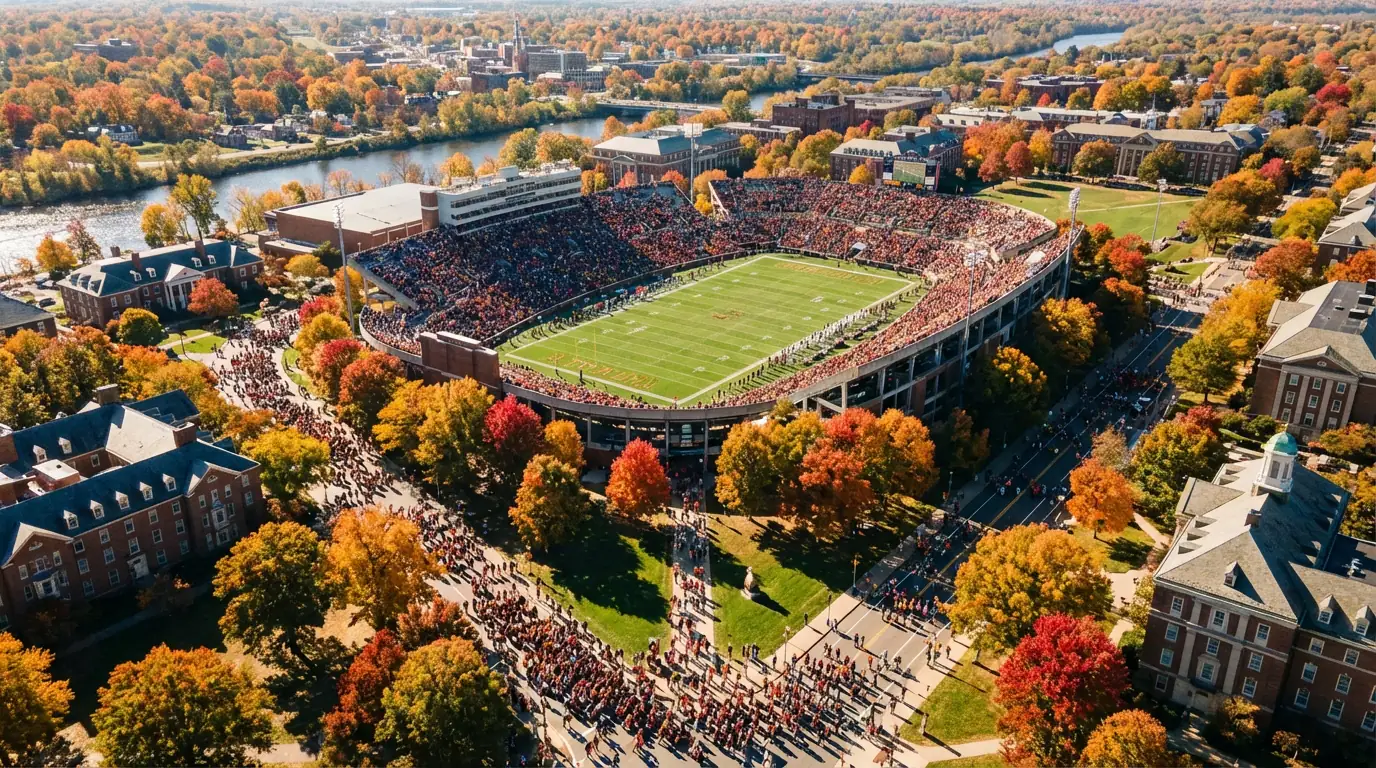 An aerial view of a college campus with a football stadium at its center